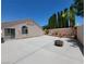 Expansive backyard features privacy wall, fire pit, and lush plants at 3197 Castle Canyon Ave, Henderson, NV 89052