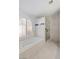 Relaxing bathroom with soaking tub, glass shower, and shuttered arched window at 3197 Castle Canyon Ave, Henderson, NV 89052