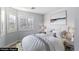 Bright bedroom features shuttered windows, neutral walls, and stylish decor with a comfortable king size bed at 3197 Castle Canyon Ave, Henderson, NV 89052