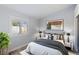 Stylish bedroom featuring decorative art, neutral walls, and shuttered windows, creating a comfortable living space at 3197 Castle Canyon Ave, Henderson, NV 89052