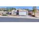 Charming single-story home featuring a two-car garage and beautifully landscaped front yard at 3197 Castle Canyon Ave, Henderson, NV 89052