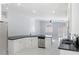 Bright, open kitchen featuring stainless steel appliances and a large island with bar seating at 3197 Castle Canyon Ave, Henderson, NV 89052