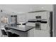 Modern kitchen featuring stainless steel appliances, breakfast bar, and plenty of cabinet space at 3197 Castle Canyon Ave, Henderson, NV 89052