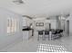 Bright, updated kitchen with stainless steel appliances, modern island, and sleek countertops at 3197 Castle Canyon Ave, Henderson, NV 89052