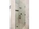 Clean, glass enclosed shower with tiled walls and modern fixtures at 3197 Castle Canyon Ave, Henderson, NV 89052