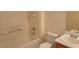 Full bathroom features a tub-shower combination, white tile surround and a white vanity at 3318 N Decatur Blvd # 1002, Las Vegas, NV 89130