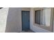 Exterior shot of the unit's front door and window showcasing the building's architecture at 3318 N Decatur Blvd # 1002, Las Vegas, NV 89130