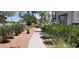 A well-maintained sidewalk lined with plants and colorful flowers at 3318 N Decatur Blvd # 1002, Las Vegas, NV 89130
