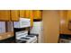 Bright kitchen with appliances, black countertops, and ample cabinet space at 3318 N Decatur Blvd # 1002, Las Vegas, NV 89130