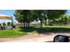 Park area with picnic tables, lush green grass, and mature trees at 3318 N Decatur Blvd # 1002, Las Vegas, NV 89130