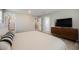 Spacious bedroom with neutral walls, soft carpet, and a large TV console, offering a modern and comfortable living space at 3525 Serravalle Ln, Henderson, NV 89044