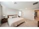 Well-lit bedroom with plush carpet, modern nightstands and a comfortable bed, creating a serene and inviting atmosphere at 3525 Serravalle Ln, Henderson, NV 89044