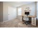 Bedroom with neutral carpet and paint, desk, and a closet with sliding doors at 3525 Serravalle Ln, Henderson, NV 89044