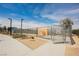 View of the community dog park and entry gate with posted rules and pet waste station for easy cleanup at 3525 Serravalle Ln, Henderson, NV 89044