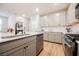 Well-designed kitchen features quartz countertops, stainless steel appliances, and a gas range at 3525 Serravalle Ln, Henderson, NV 89044