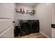 Convenient laundry room with modern side-by-side washer and dryer at 3525 Serravalle Ln, Henderson, NV 89044