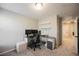 Bright office featuring a sleek desk setup, comfortable chair, and open shelving for a modern workspace at 3525 Serravalle Ln, Henderson, NV 89044