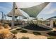 Shaded community playground with modern play structures, shade structures, and picnic pavilion for neighborhood enjoyment at 3525 Serravalle Ln, Henderson, NV 89044