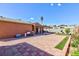 This backyard has a large open patio, an open kitchen, and a green lawn at 3814 Connie Ave, Las Vegas, NV 89115
