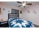 Bedroom boasts soft pink walls, ceiling fan, decorative wall art, and a cozy bedspread at 3814 Connie Ave, Las Vegas, NV 89115
