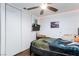 This bedroom has hardwood floors, a ceiling fan, a dresser with a mirror, and a closet at 3814 Connie Ave, Las Vegas, NV 89115