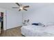 This is a bedroom with hardwood floors, a ceiling fan, a closet and a desk for studying at 3814 Connie Ave, Las Vegas, NV 89115