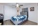 A cozy bedroom features a comfortable bed, ceiling fan, closet, and window with curtain at 3814 Connie Ave, Las Vegas, NV 89115