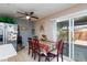 Cozy dining area with tile flooring and sliding glass doors that offer scenic views of the backyard at 3814 Connie Ave, Las Vegas, NV 89115