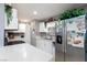 Updated kitchen with white cabinets, quartz countertops, and stainless steel appliances at 3814 Connie Ave, Las Vegas, NV 89115