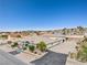 Aerial view of single story home with attached garage, mature trees and desert landscaping at 439 Cannes St, Henderson, NV 89015