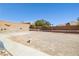 Expansive backyard with block perimeter and gravel surface, offering endless possibilities at 439 Cannes St, Henderson, NV 89015