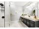 Beautiful bathroom with modern vanity, decorative mural, and walk-in shower at 439 Cannes St, Henderson, NV 89015