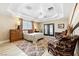 The spacious bedroom features a tray ceiling, sitting area, and plush carpeting at 439 Cannes St, Henderson, NV 89015