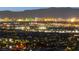 Stunning night skyline view of the city lights in a vibrant urban setting with the mountains as a backdrop at 439 Cannes St, Henderson, NV 89015