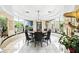 Elegant dining room with large windows, modern lighting, and decorative accents at 439 Cannes St, Henderson, NV 89015