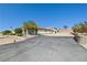 Single story home boasts mature trees, desert landscaping and a long driveway at 439 Cannes St, Henderson, NV 89015