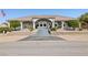 Charming single-story home with arched entry, well-manicured landscaping, and an inviting entrance at 439 Cannes St, Henderson, NV 89015