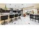Spacious kitchen features island with breakfast bar and flows into the dining area at 439 Cannes St, Henderson, NV 89015