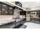 Gourmet kitchen features stainless steel appliances, granite counters, and custom cabinetry at 439 Cannes St, Henderson, NV 89015