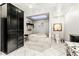 The main bathroom features a soaking tub with marble surround and cabinetry with plenty of storage at 439 Cannes St, Henderson, NV 89015