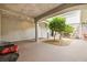 Inviting outdoor living space featuring a covered patio, stone pillars, mature trees, and a serene ambiance at 439 Cannes St, Henderson, NV 89015