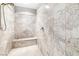 Walk in shower featuring designer tile surround, and bench seat at 439 Cannes St, Henderson, NV 89015