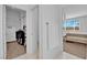 Walk-in closet and ensuite bathroom create a luxurious main bedroom suite at 45 Via Di Mello, Henderson, NV 89011