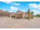 Exterior view of home with paver driveway, desert landscaping, and two-car garage at 45 Via Di Mello, Henderson, NV 89011