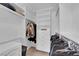 Walk-in closet features custom shelving, drawers, and hanging rods for organized storage at 45 Via Di Mello, Henderson, NV 89011