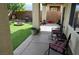 Backyard with a covered patio area, artificial grass, decorative rock, and a fire pit at 4770 Lorenzo Way, Pahrump, NV 89061