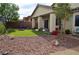 Backyard oasis featuring a well-manicured lawn, a fire pit, and plenty of room for outdoor enjoyment at 4770 Lorenzo Way, Pahrump, NV 89061