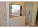 Updated bathroom features a glass-enclosed shower with dual shower heads and a window at 4770 Lorenzo Way, Pahrump, NV 89061