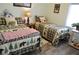 Charming bedroom featuring two twin beds with patterned bedding and matching decor at 4770 Lorenzo Way, Pahrump, NV 89061