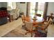 Cozy dining area with round wood table, chairs, and a view of the backyard at 4770 Lorenzo Way, Pahrump, NV 89061